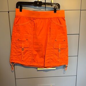 Perfect for spring and summer, this orange skirt has an elastic waist